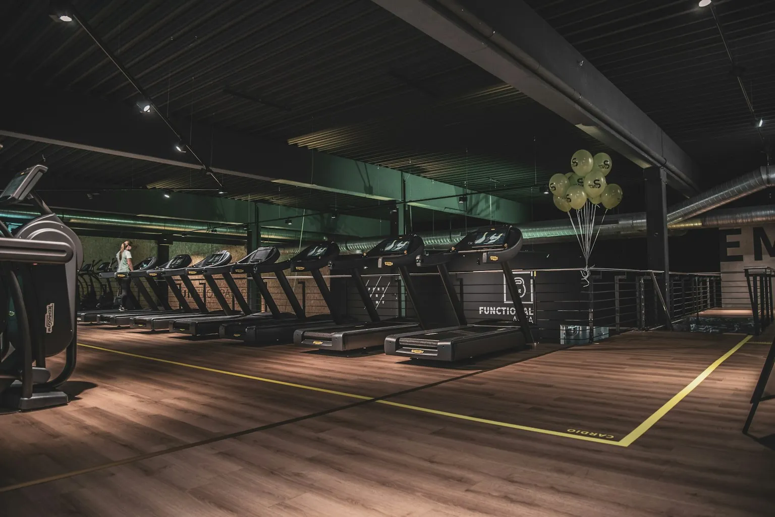 Modern gym recovery suite featuring infrared sauna and wellness amenities