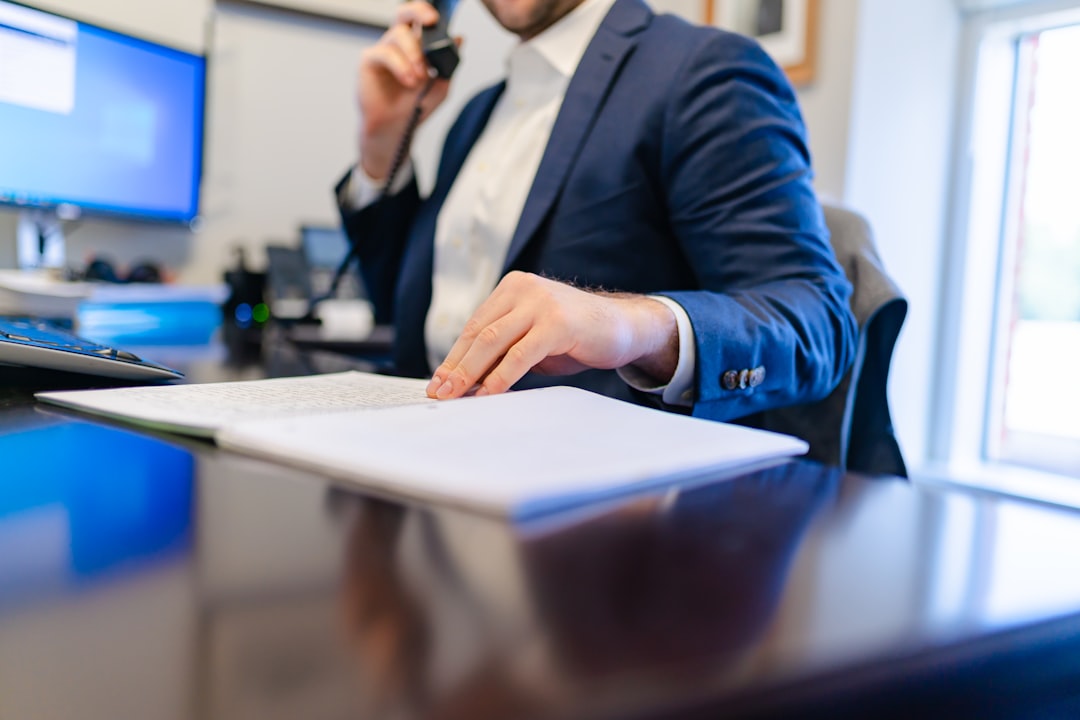 Franchise attorney reviewing financial documents at desk