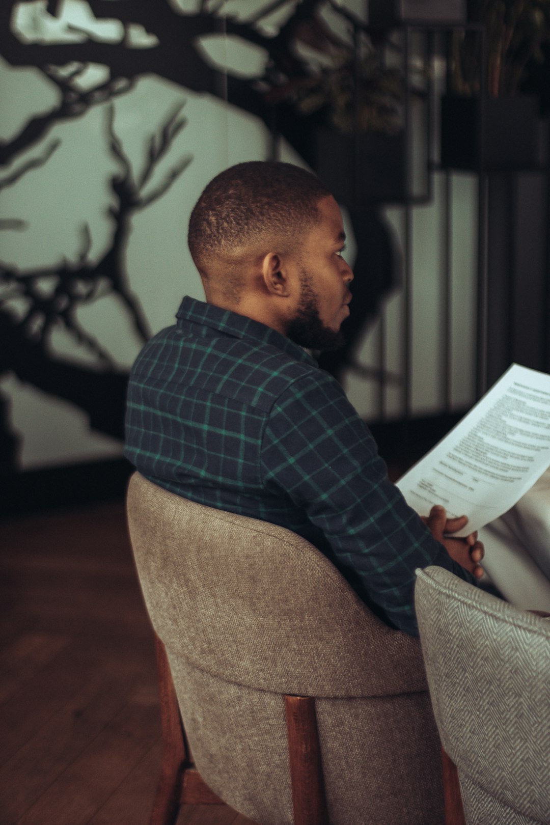Person reviewing documents at a coffee shop